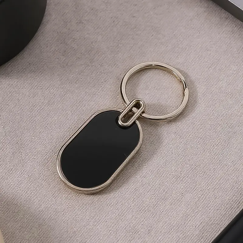 Black & Silver Oval Metal Keychain – Classic Elegant Design (1 Piece) 1
