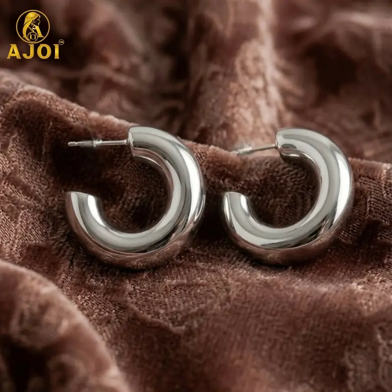 Bold Silver Chunky Hoop Earrings With Curved Contemporary Design 1