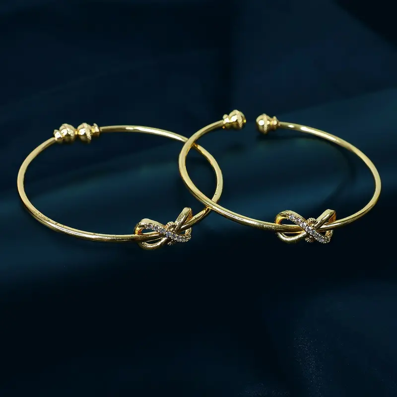 Elegant Knot Design Bangles With Stone Detailing 1