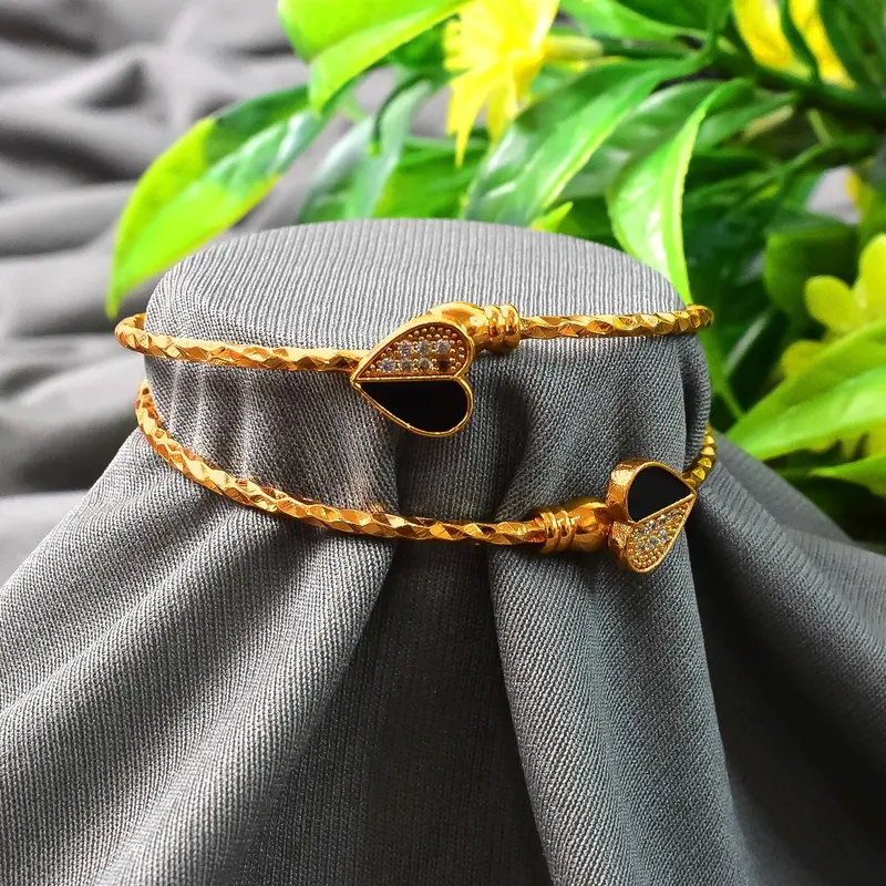 Luxe Gold-Finish Bangles – Curated Pair Combining Shine And Subtle Contemporary Flair 1