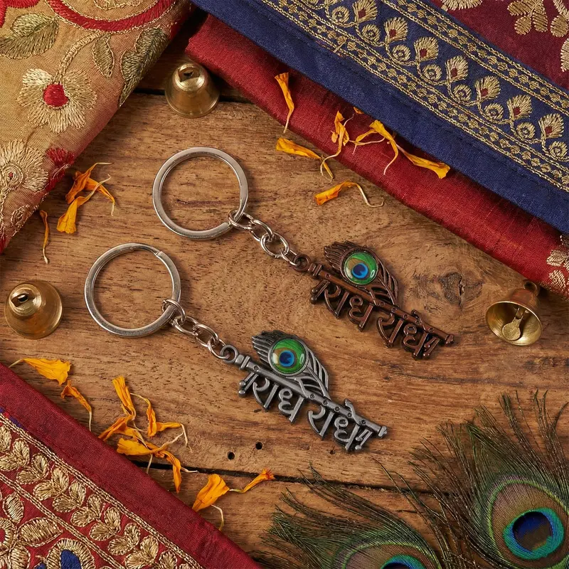 Radhe Radhe Peacock Feather Keychain – Copper-Tone Divine Charm 1
